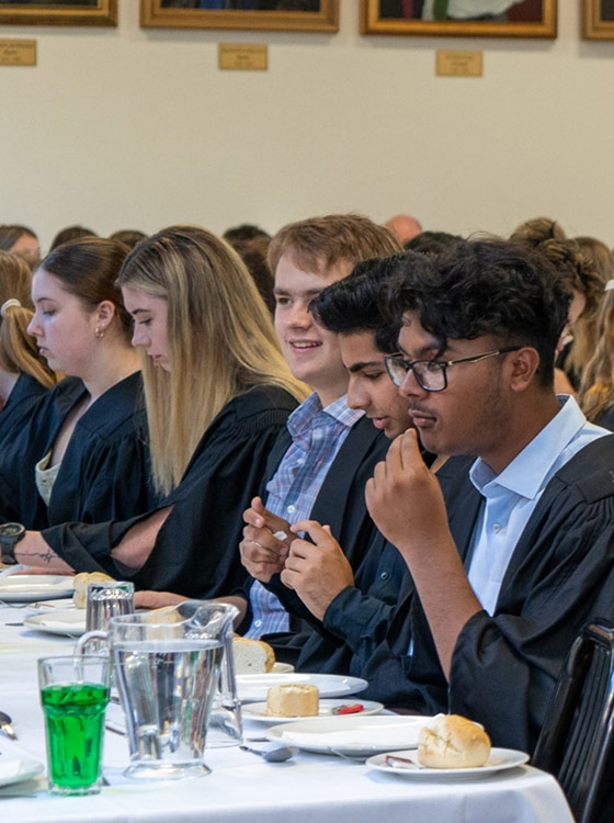 College students eating together.