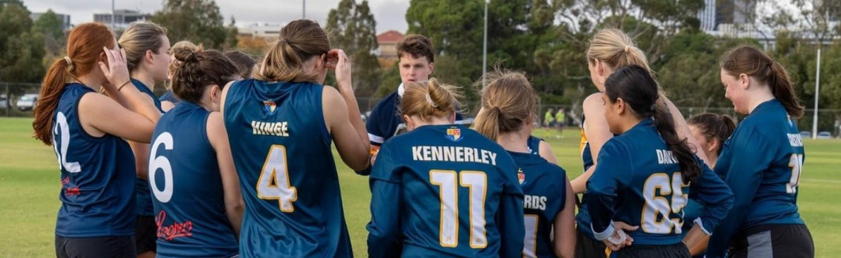 A college sports team in a huddle.